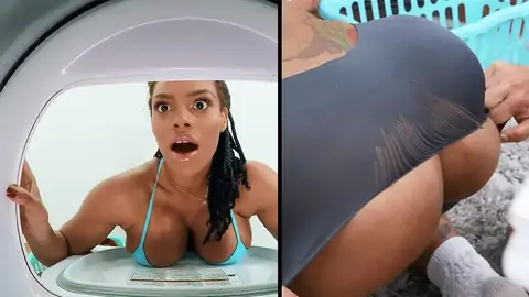 A huge-chested ebony gets stuck in the washing machine